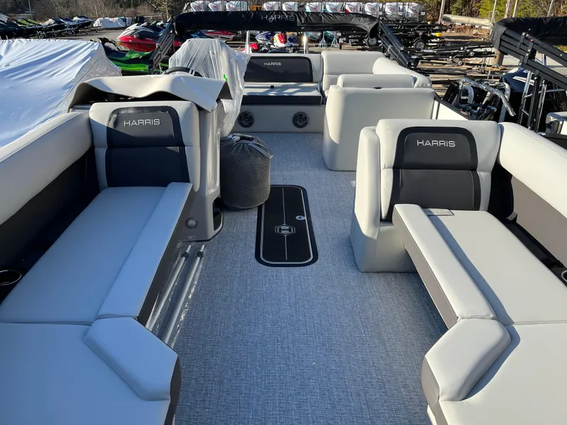 Slide: The Image of 2025 Harris Cruiser 230 pontoon boat interior with spacious seating and modern design. - 3
