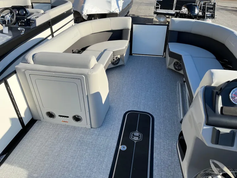 Slide: The Image of 2025 Harris Cruiser 230 boat interior with gray seating and carpeted floor. - 5