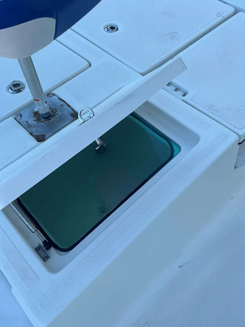 Slide: The Image of Open storage compartment on a 2017 Epic 25 SC boat deck. - 18