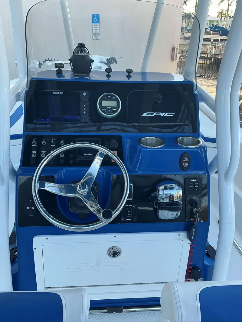 Slide: The Image of 2017 Epic 25 SC boat dashboard with steering wheel and controls. - 19