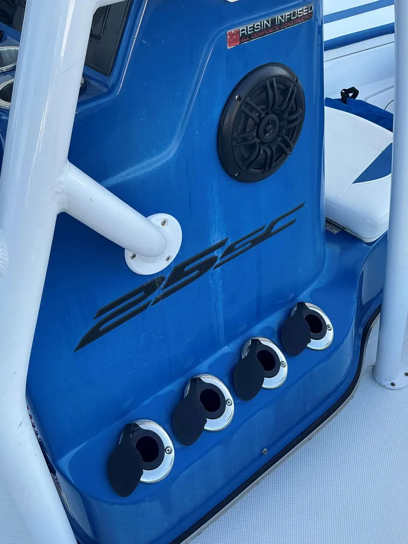 Slide: The Image of 2017 Epic 25 SC boat interior with speaker and rod holders. - 22