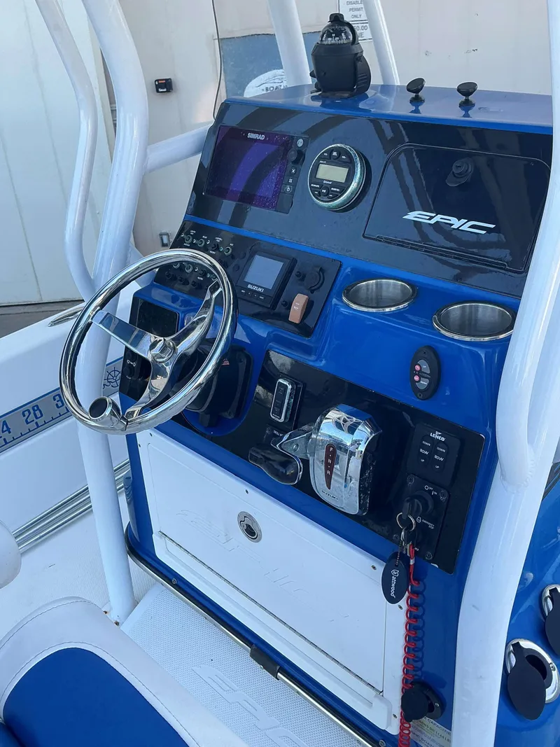 Slide: The Image of 2017 Epic 25 SC boat dashboard with steering wheel and navigation controls. - 9
