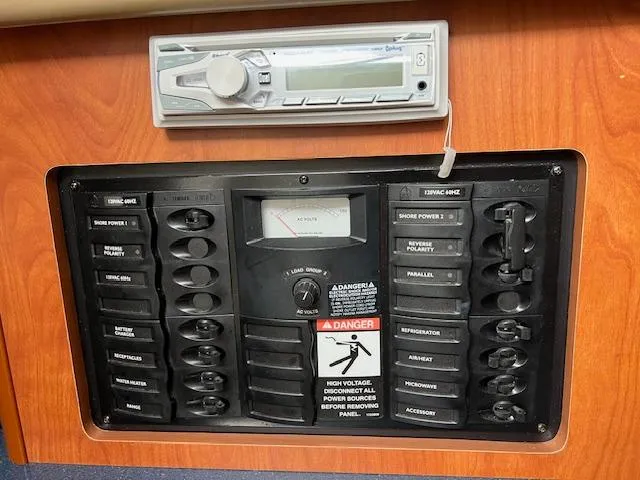 Slide: The Image of Electrical control panel and stereo system on a 2006 Bayliner 275 boat. - 23