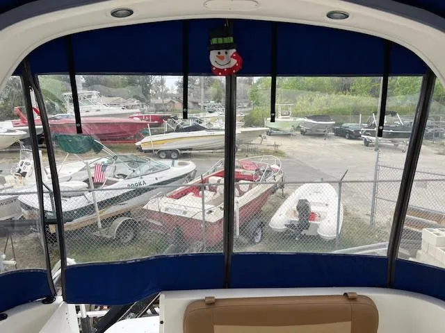 Slide: The Image of View from 2006 Bayliner 275 boat, overlooking a marina with various boats. - 28