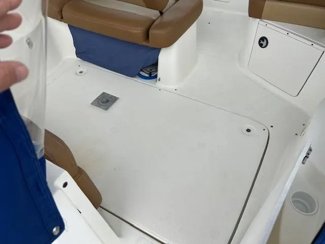 Slide: The Image of Interior view of a 2006 Bayliner 275 boat, featuring seating and storage compartments. - 9