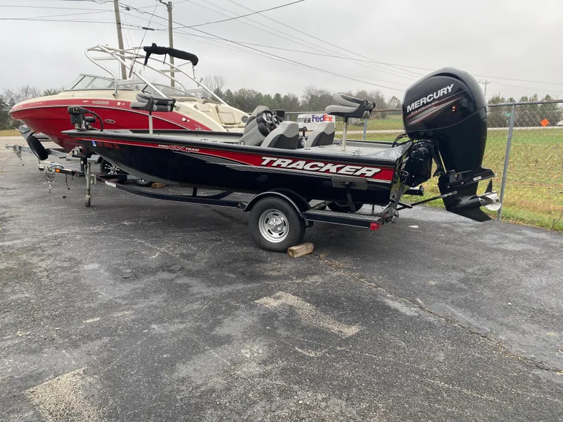Slide: The Image of 2016 Tracker Pro Team 195 TXW boat with Mercury engine on a trailer. - 11