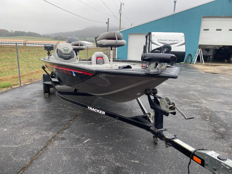 Slide: The Image of 2016 Tracker Pro Team 195 TXW fishing boat on trailer, parked outdoors. - 15