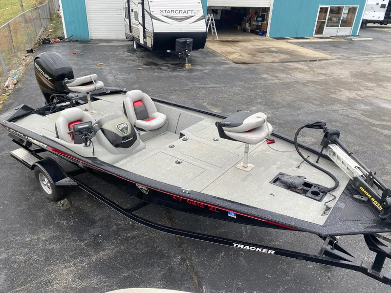 Slide: The Image of 2016 Tracker Pro Team 195 TXW fishing boat on trailer, parked outdoors. - 3