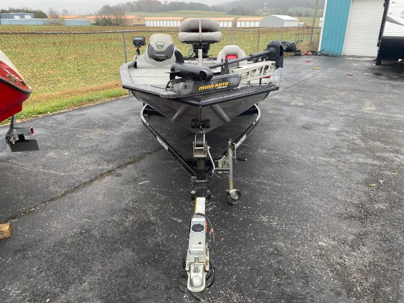 Slide: The Image of 2016 Tracker Pro Team 195 TXW fishing boat on trailer in parking lot. - 4