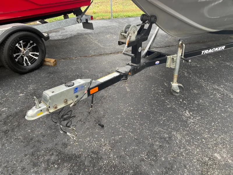 Slide: The Image of 2016 Tracker Pro Team 195 TXW boat trailer hitch on asphalt. - 5