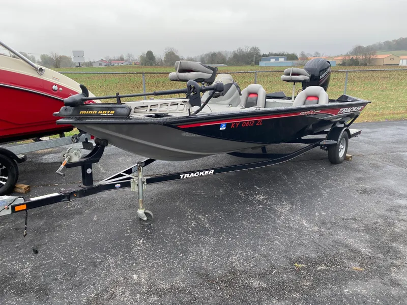 Slide: The Image of 2016 Tracker Pro Team 195 TXW fishing boat on trailer, parked outdoors. - 7