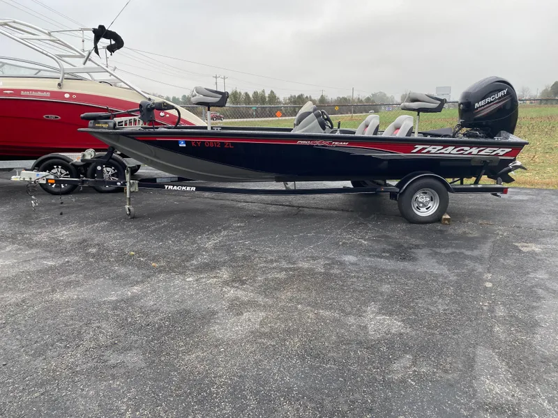 Slide: The Image of 2016 Tracker Pro Team 195 TXW boat on trailer, parked outdoors. - 8