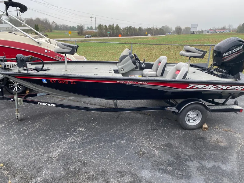 Slide: The Image of 2016 Tracker Pro Team 195 TXW fishing boat on trailer, parked outdoors. - 9