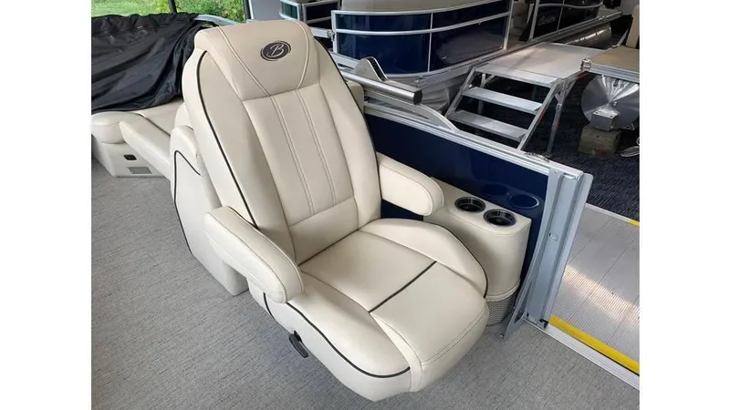 Slide: The Image of 2019 Barletta E20QC boat seat with cup holders, featuring luxurious beige upholstery. - 10