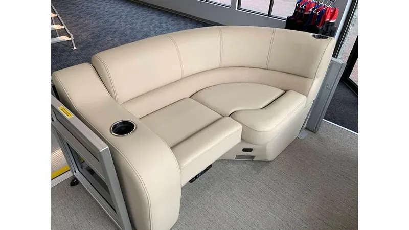 Slide: The Image of 2019 Barletta E20QC boat interior with beige seating and cup holder. - 13