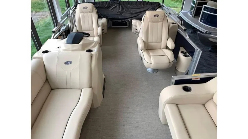 Slide: The Image of 2019 Barletta E20QC pontoon boat interior with beige seating and modern design. - 15