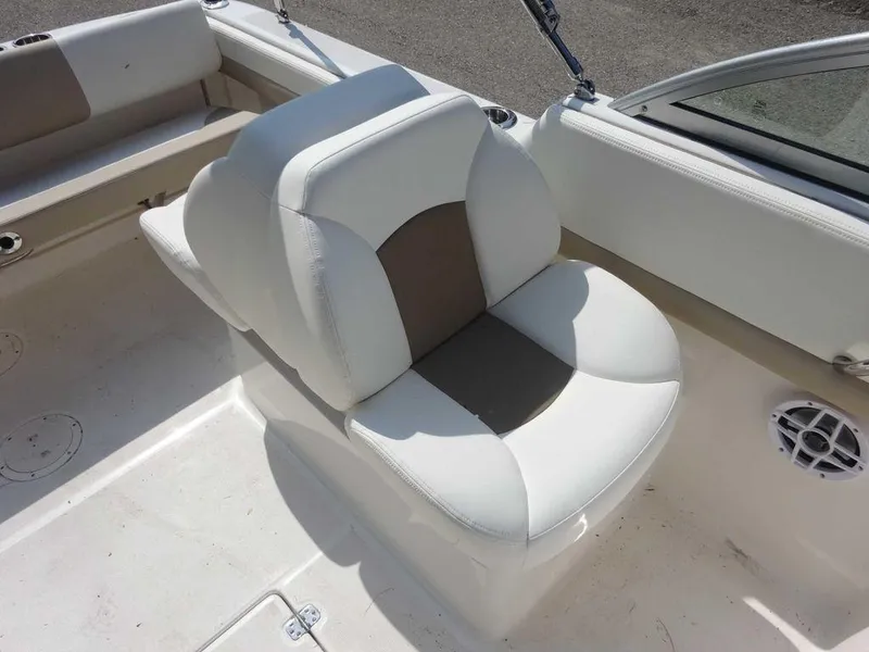 Slide: The Image of 2023 Robalo R227 boat interior with white and beige seating. - 12