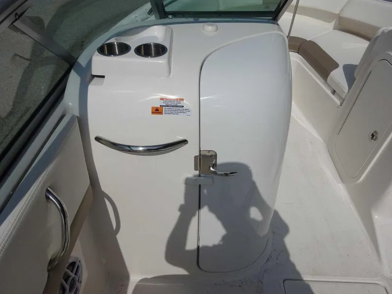 Slide: The Image of 2023 Robalo R227 boat interior with cup holders and seating area. - 15