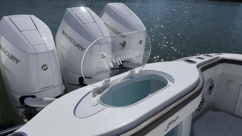 Slide: The Image of 2025 Yellowfin 39 Offshore boat with triple Mercury engines on water. - 21