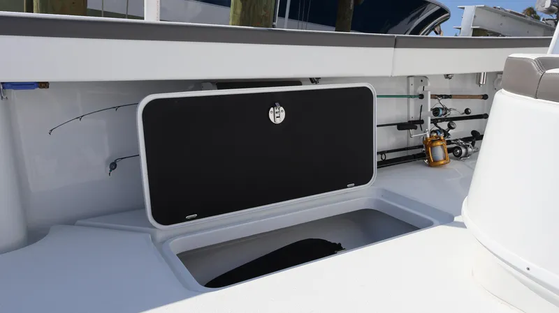 Slide: The Image of 2025 Yellowfin 39 Offshore boat interior with fishing rod storage compartment. - 26