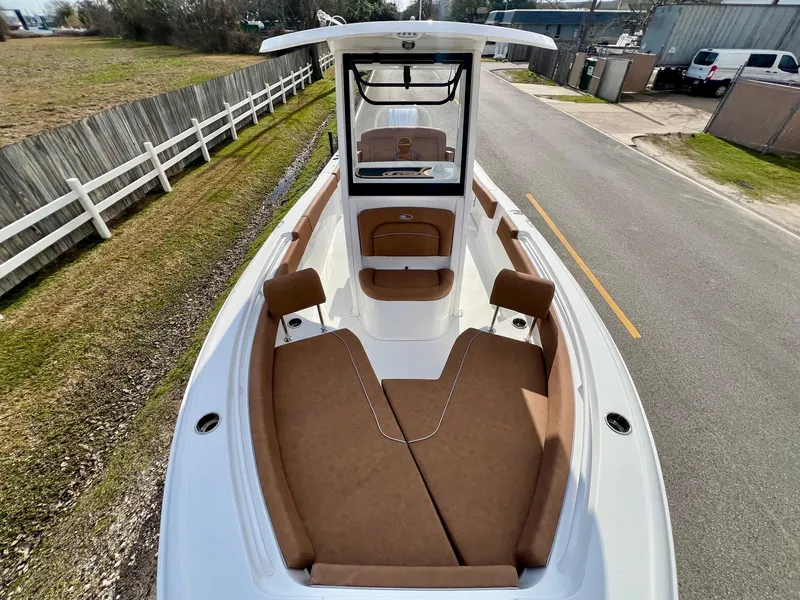 Slide: The Image of 2025 Sea Hunt Ultra 235 SE boat with spacious seating and sleek design. - 15