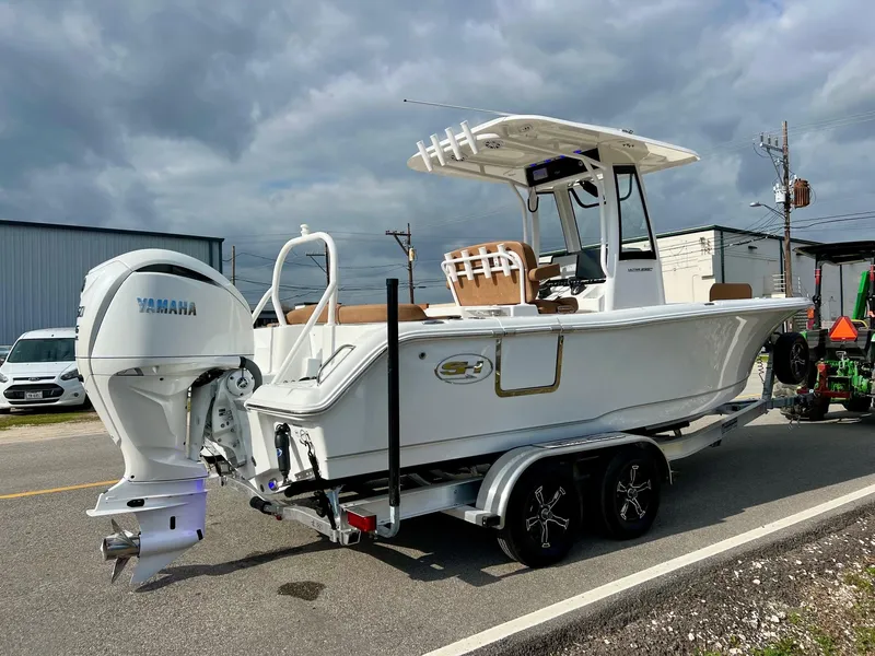 Slide: The Image of 2025 Sea Hunt Ultra 235 SE boat on trailer with Yamaha outboard motor. - 4