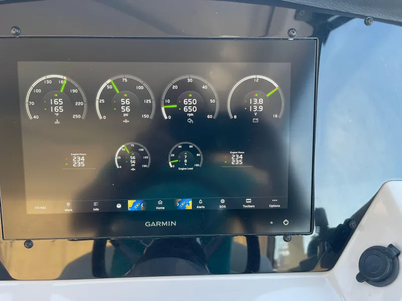 Slide: The Image of Garmin display on 2021 Regal 35 Sport Coupe dashboard showing engine metrics. - 30