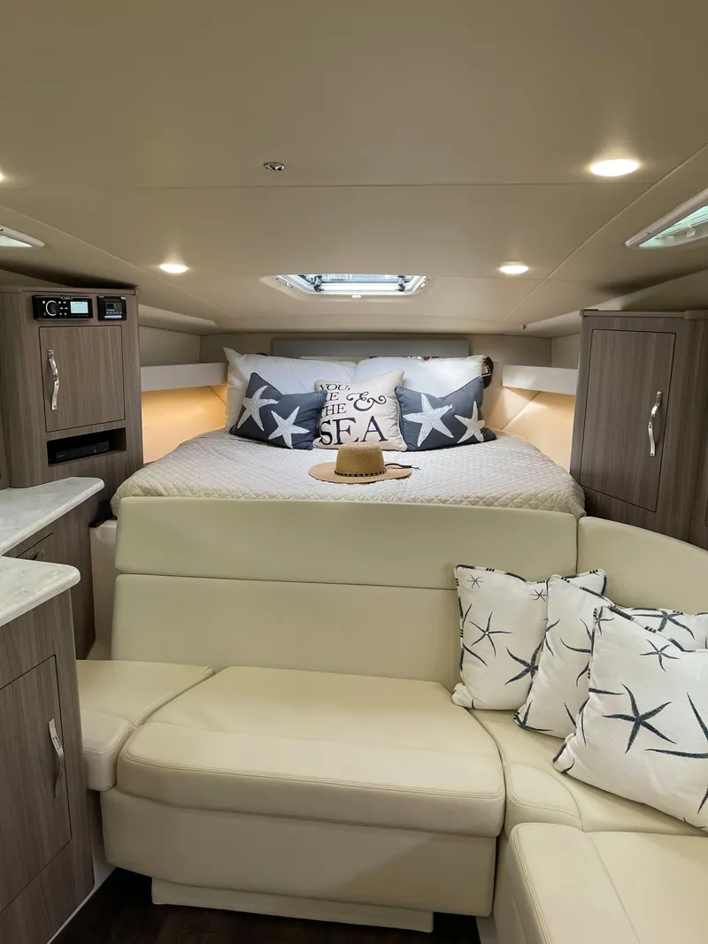 Slide: The Image of Interior of 2021 Regal 35 Sport Coupe with cozy bed and stylish decor. - 37