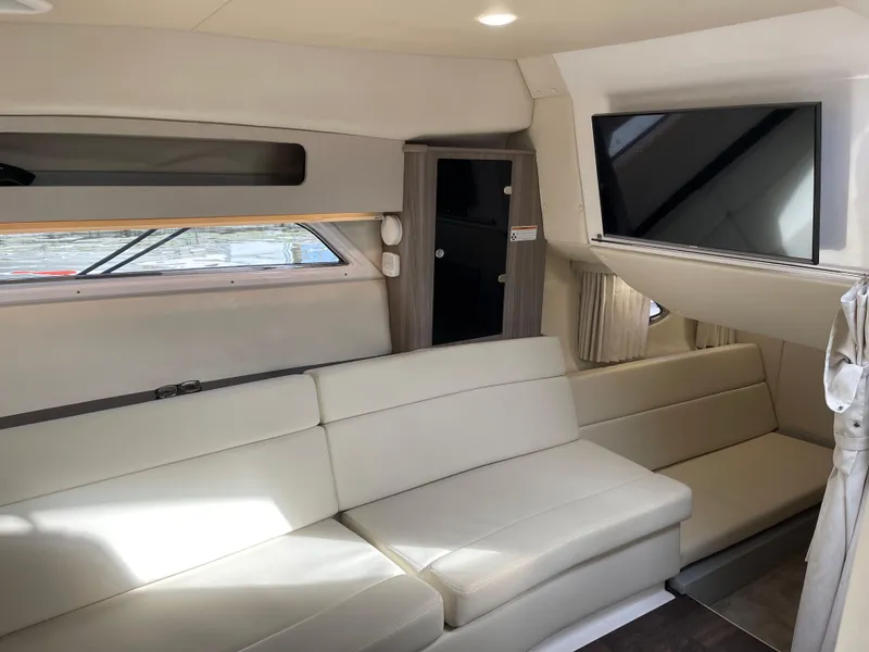 Slide: The Image of Interior of 2021 Regal 35 Sport Coupe with modern seating and mounted TV. - 39