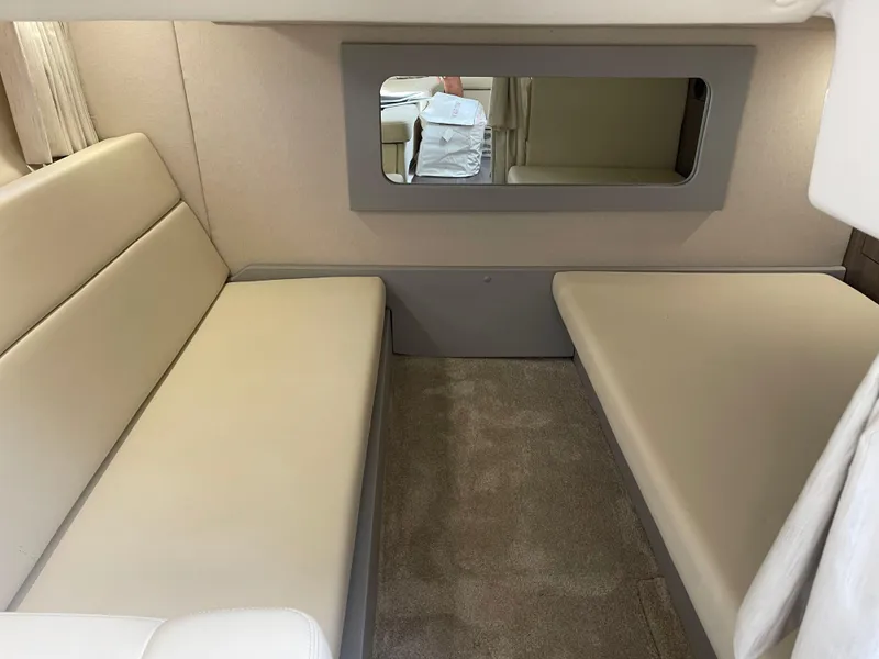 Slide: The Image of Interior cabin of 2021 Regal 35 Sport Coupe with beige seating and carpet. - 43