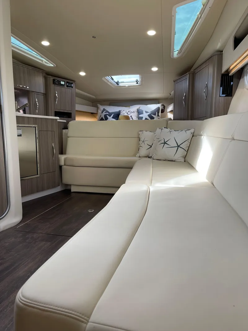 Slide: The Image of Interior of 2021 Regal 35 Sport Coupe with modern seating and skylights. - 45