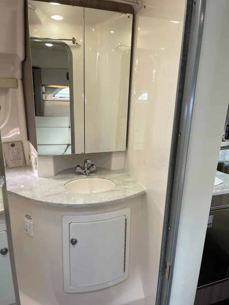 Slide: The Image of 2021 Regal 35 Sport Coupe bathroom with mirrored cabinet and sink. - 49