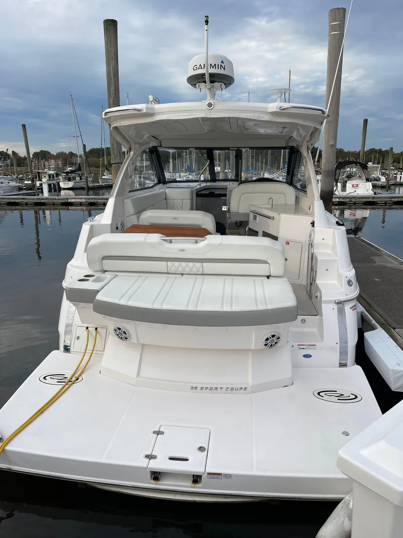 Slide: The Image of 2021 Regal 35 Sport Coupe yacht docked at marina, rear view. - 9