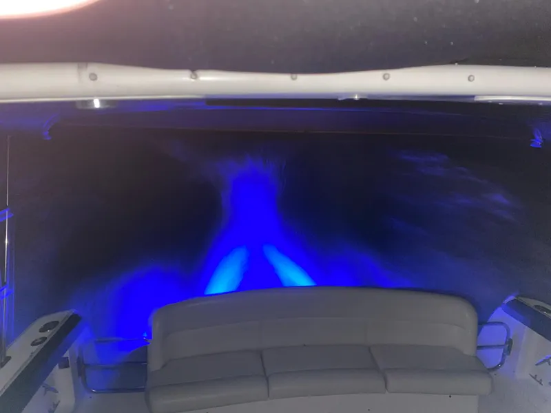 Slide: The Image of 1997 Tiara Yachts 4000 Express with blue underwater lights at night. - 36