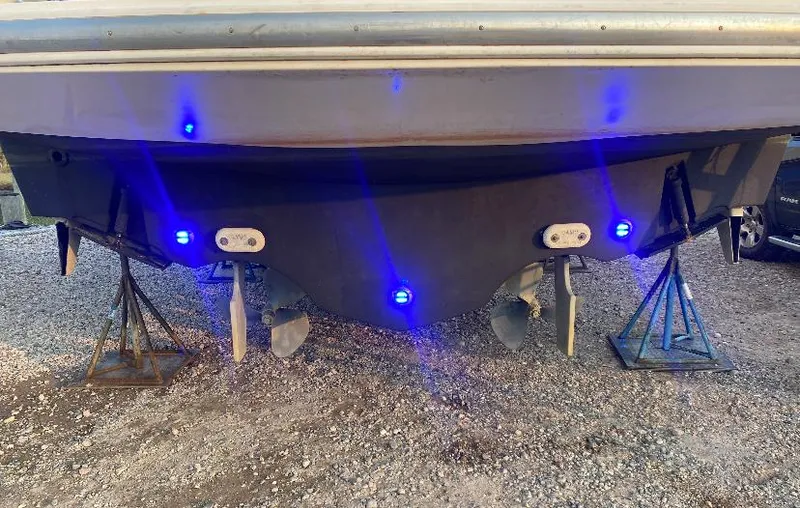 Slide: The Image of 1997 Tiara Yachts 4000 Express with blue underwater lights on dry dock. - 5