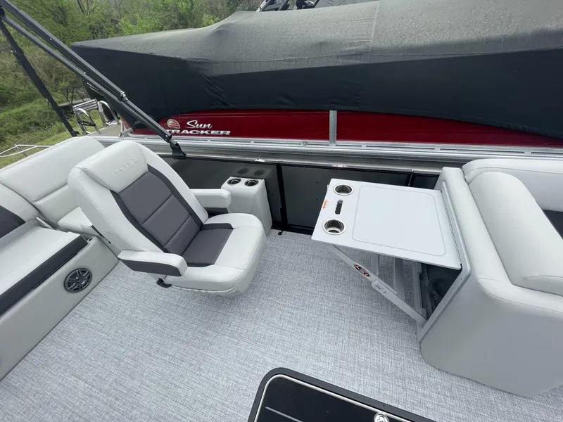 Slide: The Image of 2025 Harris Cruiser 230 interior with seating and table, featuring modern design and comfort. - 12