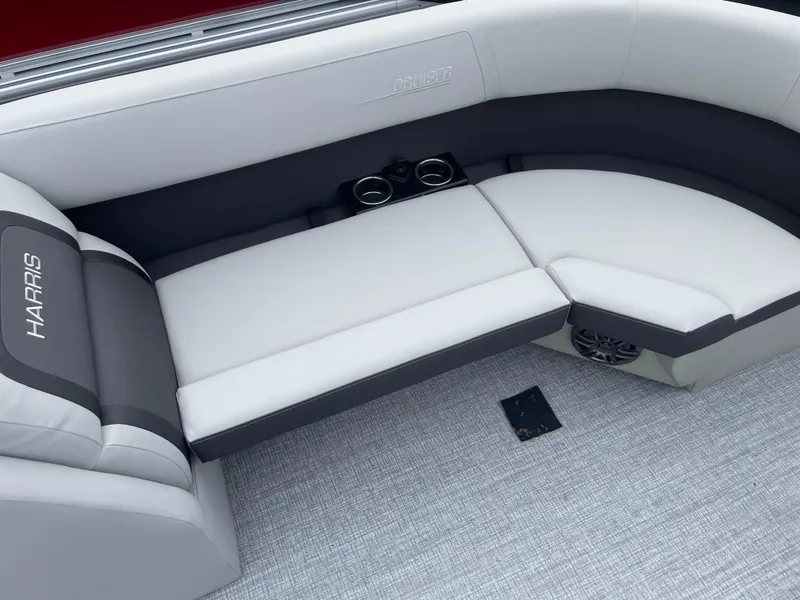 Slide: The Image of 2025 Harris Cruiser 230 boat interior with cushioned seating and cup holders. - 3
