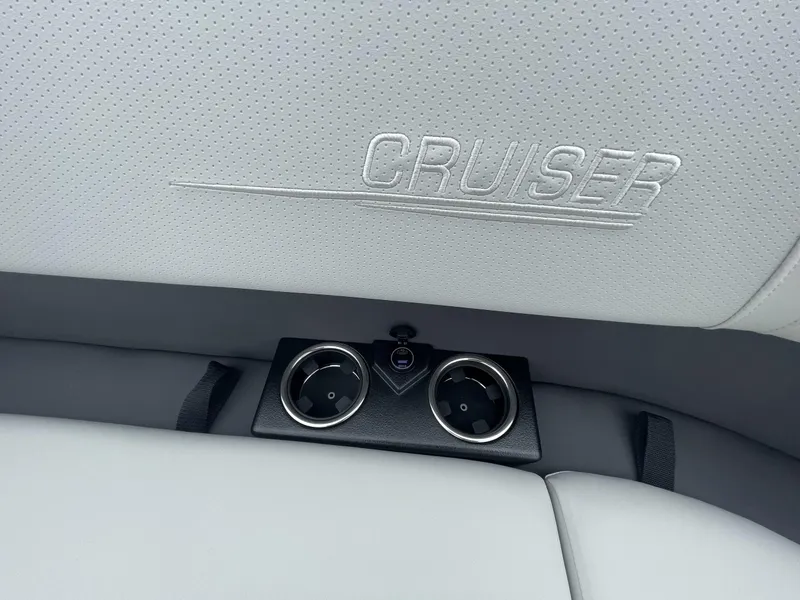 Slide: The Image of 2025 Harris Cruiser 230 interior with embossed logo and cup holders. - 8