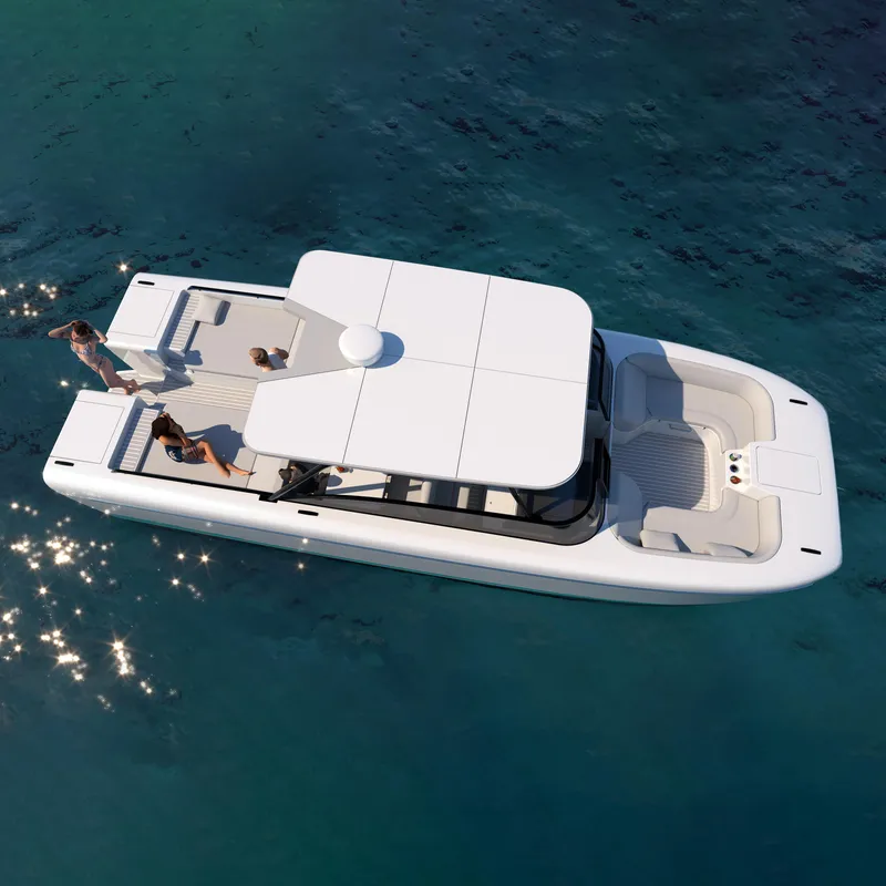 Slide: The Image of 2025 Canados Heritage 36 yacht cruising on blue ocean near rocky coastline. - 1