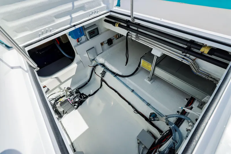 Slide: The Image of Engine compartment of 2025 Canados Heritage 36 yacht, showcasing wiring and mechanical components. - 23