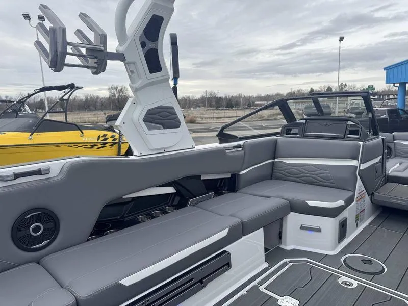 Slide: The Image of 2025 Supra SL boat interior with gray seating and modern design features. - 10