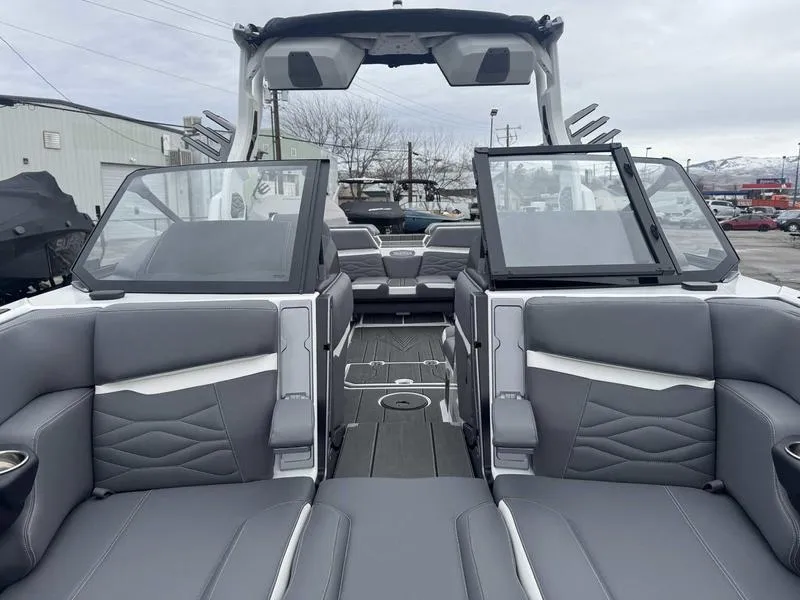 Slide: The Image of 2025 Supra SL boat interior with gray seating and open windshield, showcasing modern design. - 15