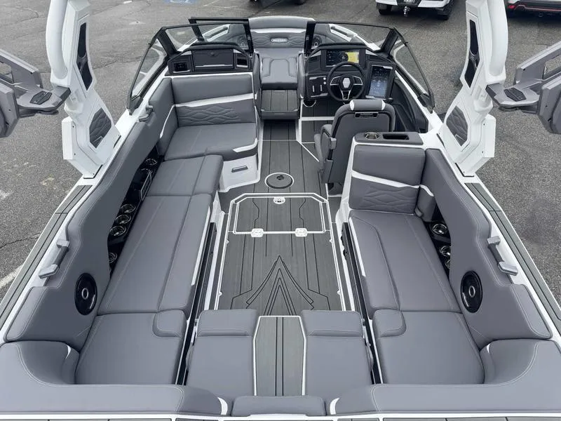 Slide: The Image of 2025 Supra SL boat interior with sleek gray seating and modern dashboard design. - 8
