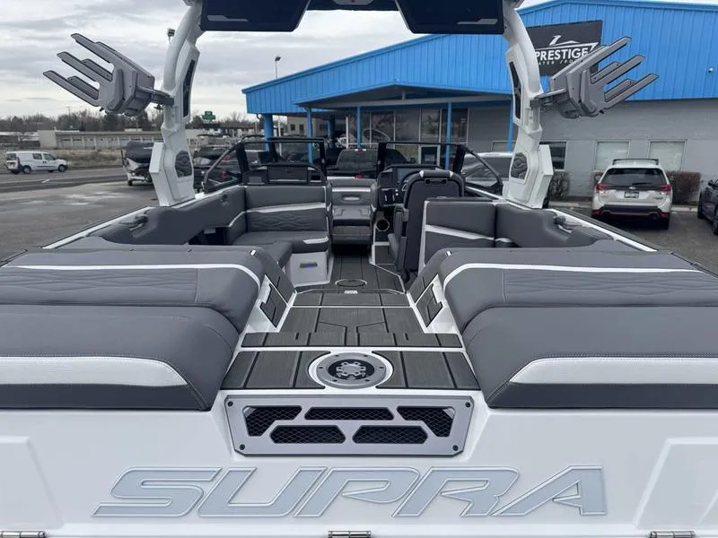 Slide: The Image of 2025 Supra SL boat interior with gray seating, spacious layout, and modern design. - 9