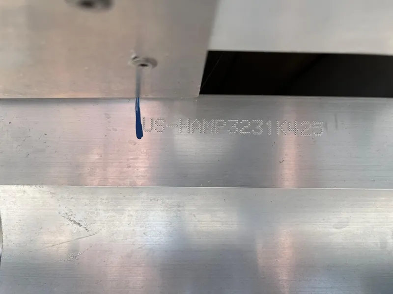 Slide: The Image of VIN number on a 2025 Harris Cruiser 230 boat hull. - 13