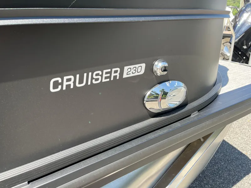 Slide: The Image of 2025 Harris Cruiser 230 boat exterior with chrome details and model name. - 6