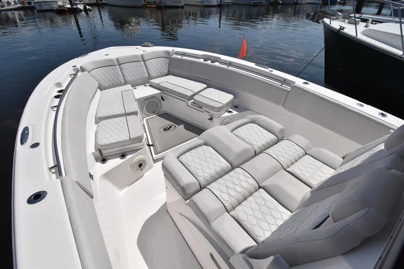 Slide: The Image of 2021 Sea Fox 368 boat with spacious seating and modern design at a marina. - 4