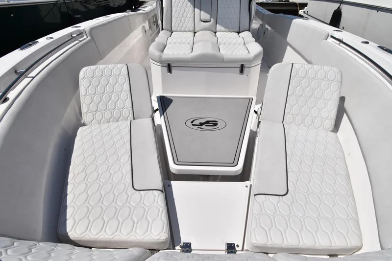 Slide: The Image of 2021 Sea Fox 368 boat interior with white cushioned seating and center table. - 5
