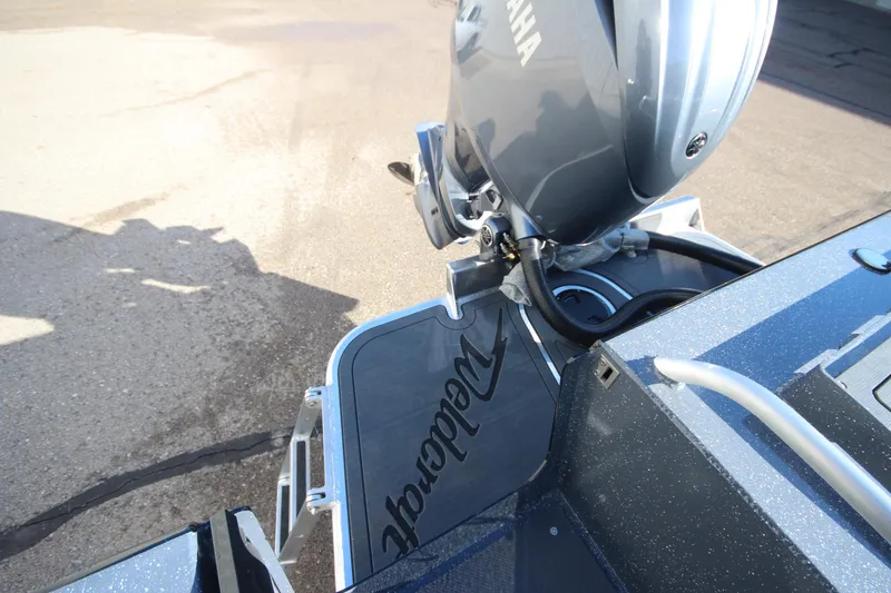 Slide: The Image of 2025 Weldcraft 210 Revolution Soft Top with Yamaha engine, rear view. - 11