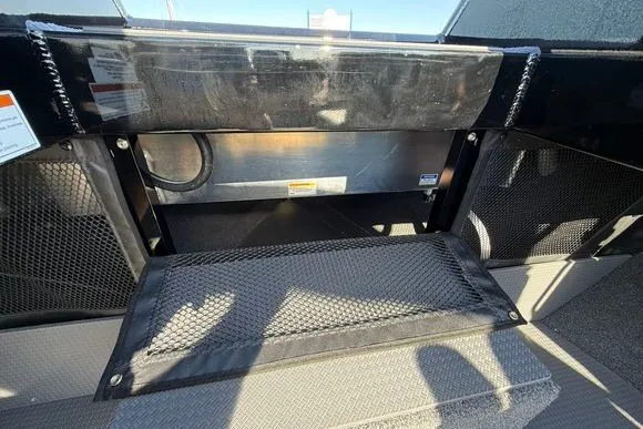 Slide: The Image of Interior view of 2025 Weldcraft 210 Revolution boat with storage compartments. - 31